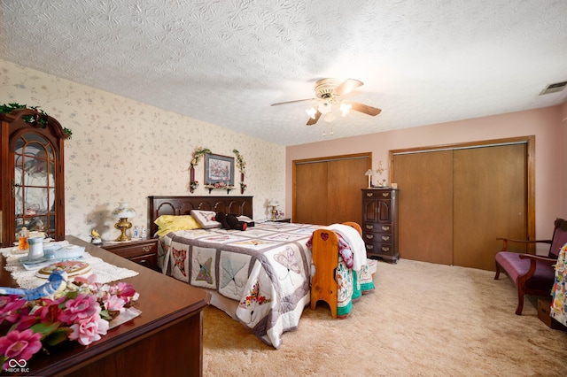 5081 N 500 W, Fairland, IN 46126 - carpeted bedroom with two closets, wallpapered walls, ceiling fan, and a textured ceiling