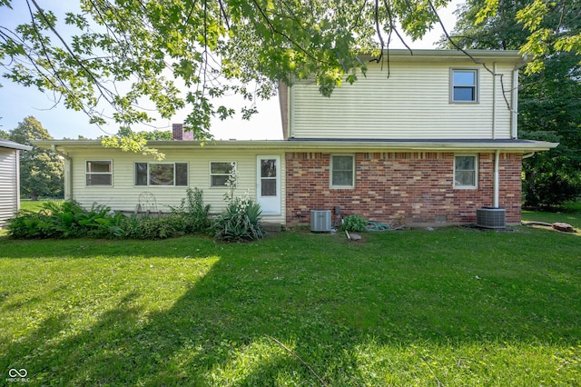 5081 N 500 W, Fairland, IN 46126 - back of property featuring a lawn, a chimney, and brick siding
