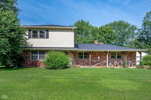 5081 N 500 W, Fairland, IN 46126 - view of front facade featuring a chimney, a front yard, and brick siding