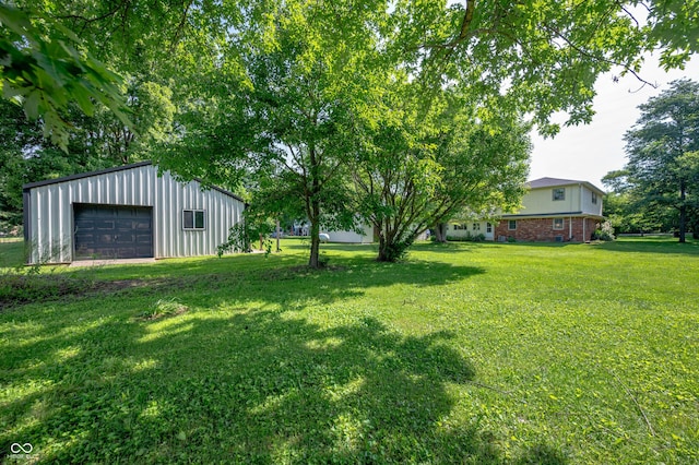 5081 N 500 W, Fairland, IN 46126 - view of grassy yard featuring a garage and an outbuilding