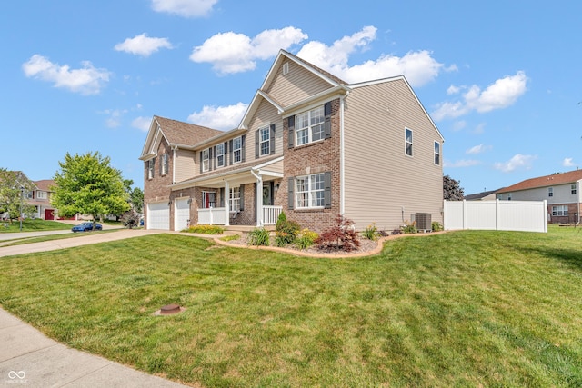 7047 Lancaster Ln, Avon, IN 46123 - view of front of house with brick siding, a porch, a garage, and concrete driveway