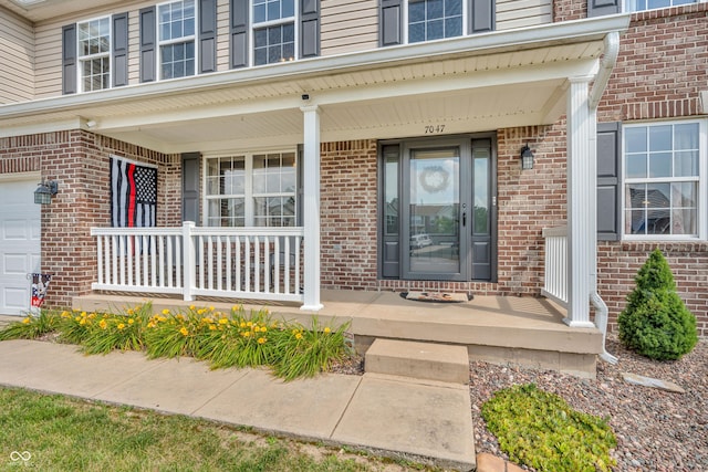 7047 Lancaster Ln, Avon, IN 46123 - property entrance with covered porch and brick siding