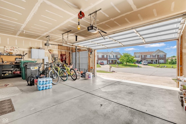 7047 Lancaster Ln, Avon, IN 46123 - garage with a garage door opener and a residential view