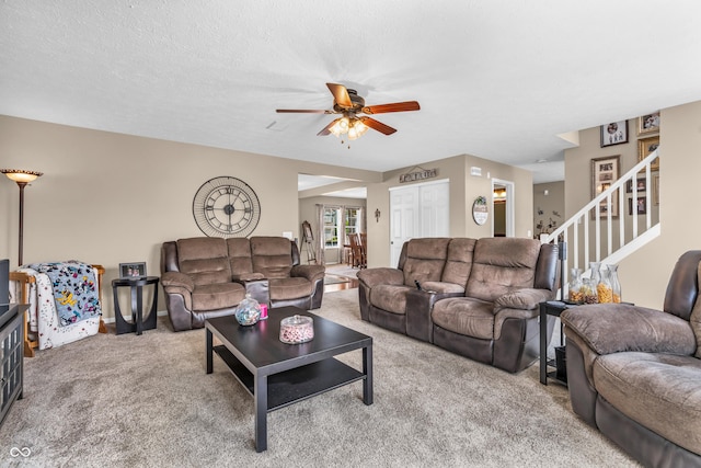 7047 Lancaster Ln, Avon, IN 46123 - living area featuring carpet, ceiling fan, and stairs