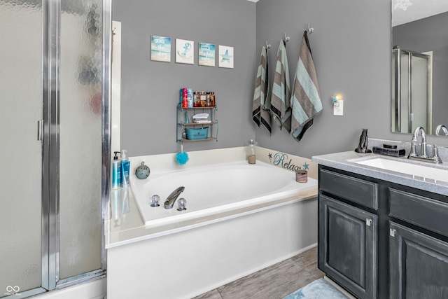 7047 Lancaster Ln, Avon, IN 46123 - bathroom with a stall shower, vanity, and a garden tub