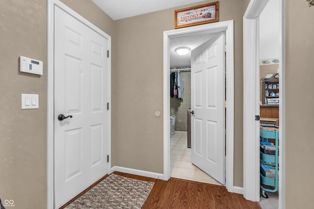 7047 Lancaster Ln, Avon, IN 46123 - hallway featuring baseboards and wood finished floors