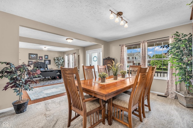 7047 Lancaster Ln, Avon, IN 46123 - dining space with light carpet, a textured ceiling, and an office area