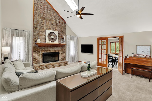 369 Rodeo Dr, Indianapolis, IN 46217 - living room featuring high vaulted ceiling, light colored carpet, a ceiling fan, and a fireplace