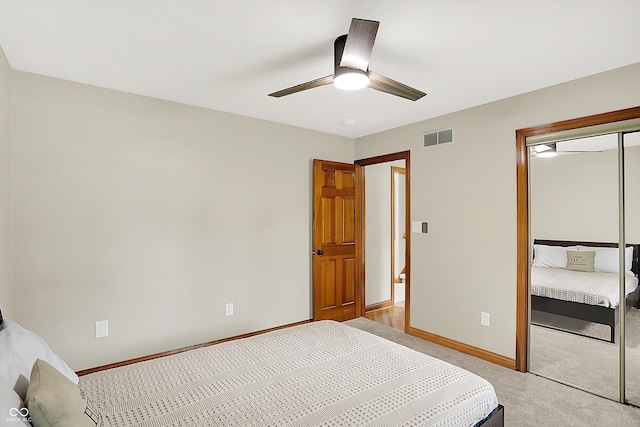 369 Rodeo Dr, Indianapolis, IN 46217 - bedroom with a closet, light colored carpet, and ceiling fan