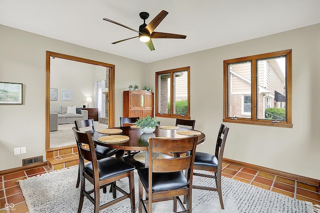 369 Rodeo Dr, Indianapolis, IN 46217 - tiled dining room featuring baseboards and ceiling fan