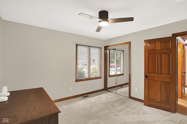 369 Rodeo Dr, Indianapolis, IN 46217 - unfurnished bedroom with light colored carpet, a closet, and ceiling fan