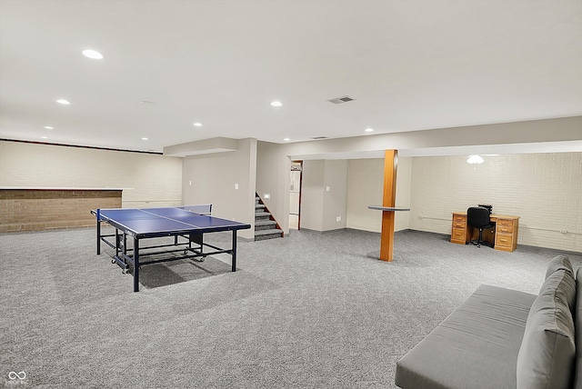 369 Rodeo Dr, Indianapolis, IN 46217 - game room with an office area, carpet flooring, recessed lighting, and brick wall