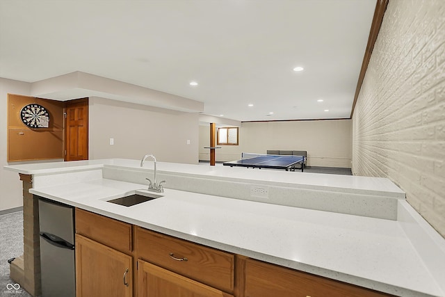 369 Rodeo Dr, Indianapolis, IN 46217 - kitchen featuring light countertops, refrigerator, brown cabinets, and recessed lighting