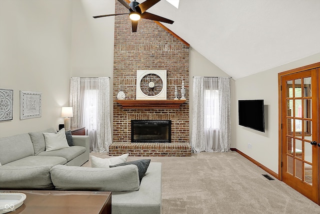369 Rodeo Dr, Indianapolis, IN 46217 - living room featuring high vaulted ceiling, ceiling fan, healthy amount of natural light, carpet floors, and a fireplace