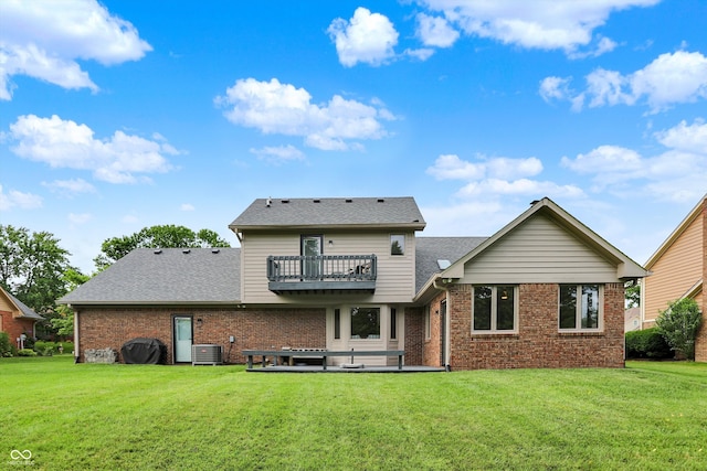 369 Rodeo Dr, Indianapolis, IN 46217 - rear view of property with brick siding, a yard, roof with shingles, and a balcony