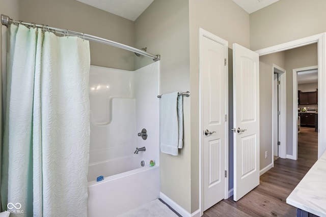1209 E Wabash St, Frankfort, IN 46041 - bathroom with shower / tub combo and wood finished floors