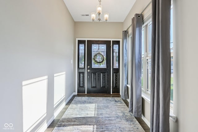 1209 E Wabash St, Frankfort, IN 46041 - foyer featuring a chandelier and wood finished floors