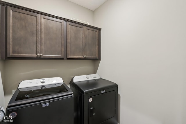 1209 E Wabash St, Frankfort, IN 46041 - laundry area with cabinet space and separate washer and dryer