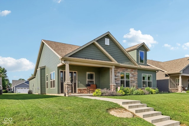 1209 E Wabash St, Frankfort, IN 46041 - view of front of house with a porch, a front lawn, stone siding, and a shingled roof