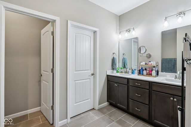 1209 E Wabash St, Frankfort, IN 46041 - full bathroom featuring double vanity and tile patterned flooring