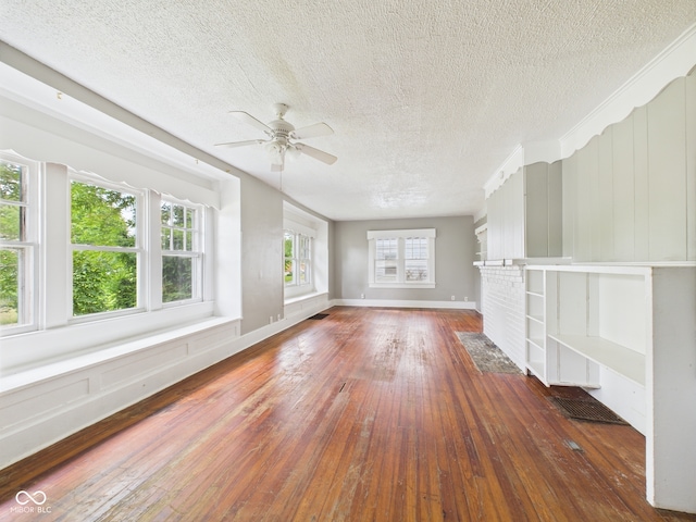 1201 Arrow Ave, Anderson, IN 46016 - unfurnished living room featuring hardwood / wood-style floors, a ceiling fan, and a textured ceiling