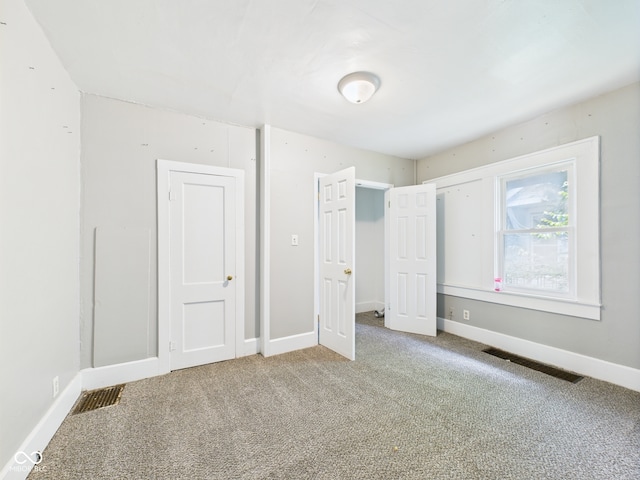 1201 Arrow Ave, Anderson, IN 46016 - unfurnished bedroom with carpet flooring and baseboards
