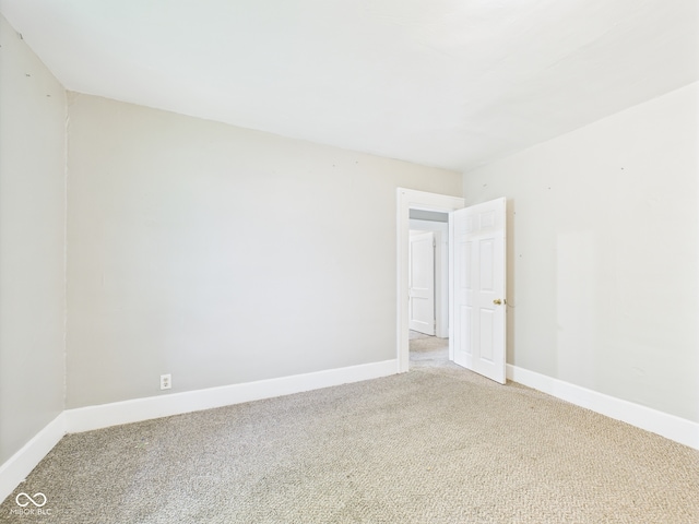 1201 Arrow Ave, Anderson, IN 46016 - spare room with light carpet and baseboards