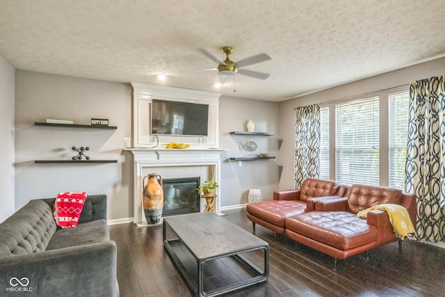 14156 Avalon E Dr, Fishers, IN 46037 - living room with a ceiling fan, a textured ceiling, hardwood / wood-style floors, and a tile fireplace
