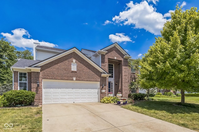 14156 Avalon E Dr, Fishers, IN 46037 - traditional-style house with brick siding, a garage, a front lawn, and driveway