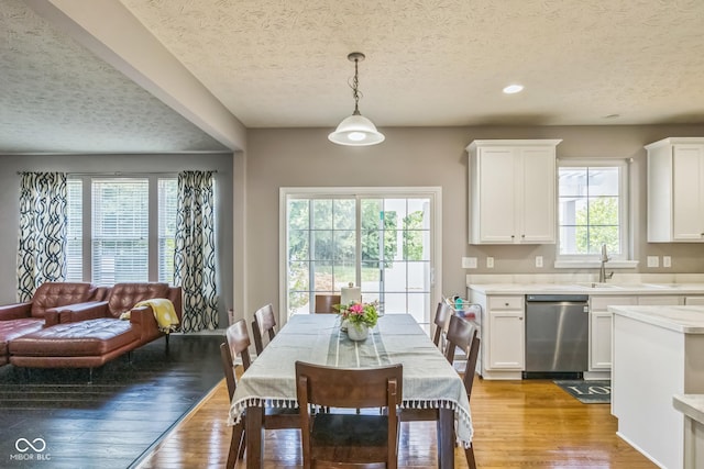 14156 Avalon E Dr, Fishers, IN 46037 - dining area featuring a textured ceiling, light wood-style floors, and recessed lighting