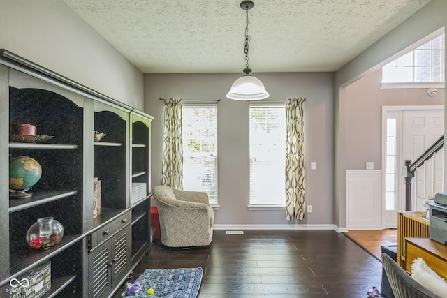 14156 Avalon E Dr, Fishers, IN 46037 - sitting room with dark wood-type flooring, healthy amount of natural light, and a textured ceiling