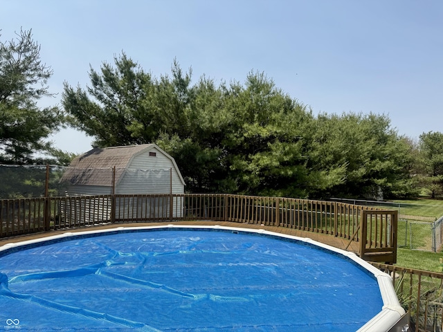 4065 W New Castle Rd, Frankfort, IN 46041 - view of swimming pool featuring a fenced backyard and a storage shed