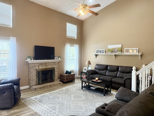 4065 W New Castle Rd, Frankfort, IN 46041 - living area featuring high vaulted ceiling, ceiling fan, wood finished floors, and a brick fireplace