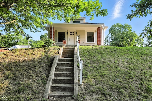 1430 W 14th St, Anderson, IN 46016 - bungalow-style house with stairway and covered porch