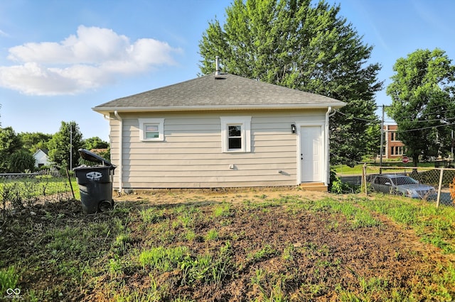 1430 W 14th St, Anderson, IN 46016 - rear view of house featuring a shingled roof