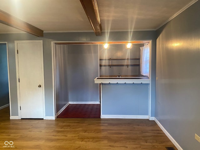 8008 Cherington Dr, Indianapolis, IN 46227 - kitchen featuring wood finished floors, beamed ceiling, and crown molding