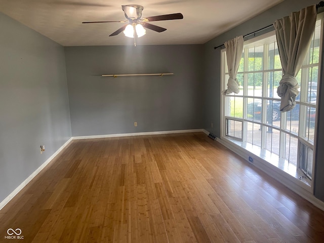 8008 Cherington Dr, Indianapolis, IN 46227 - spare room with a ceiling fan and wood finished floors