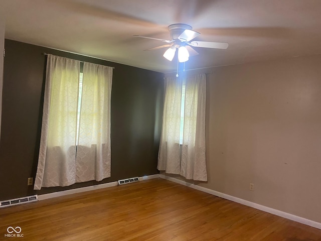 8008 Cherington Dr, Indianapolis, IN 46227 - spare room with ceiling fan and wood finished floors