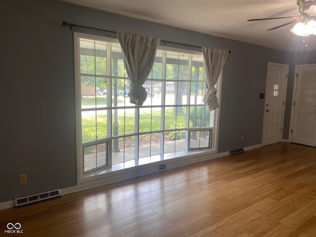 8008 Cherington Dr, Indianapolis, IN 46227 - unfurnished living room with ceiling fan and wood finished floors