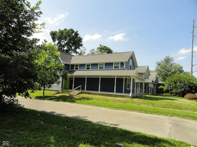 2502 N Harding St, Indianapolis, IN 46208 - back of house with a yard and roof with shingles