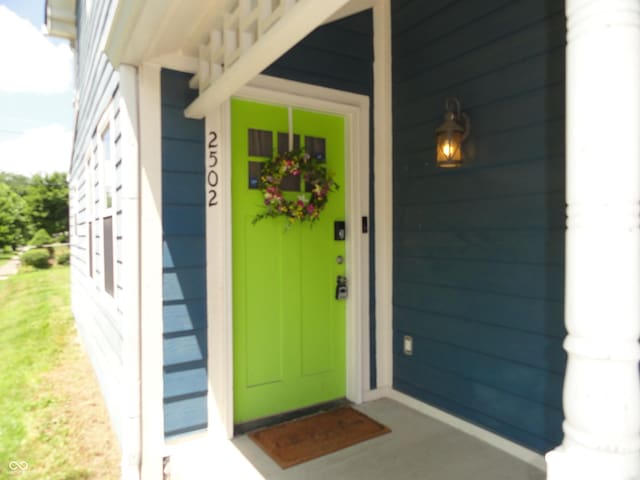 2502 N Harding St, Indianapolis, IN 46208 - doorway to property featuring covered porch