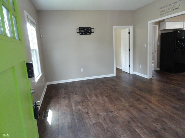 2502 N Harding St, Indianapolis, IN 46208 - empty room with dark wood-style flooring and baseboards