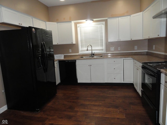 2502 N Harding St, Indianapolis, IN 46208 - kitchen featuring black appliances, extractor fan, white cabinetry, and dark wood-style flooring