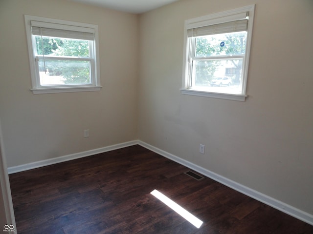 2502 N Harding St, Indianapolis, IN 46208 - spare room featuring healthy amount of natural light and dark wood-style flooring