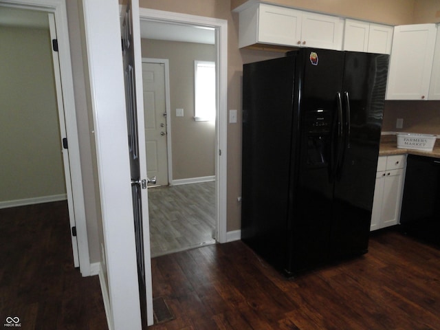 2502 N Harding St, Indianapolis, IN 46208 - kitchen with black appliances, dark wood-style floors, white cabinets, and light countertops