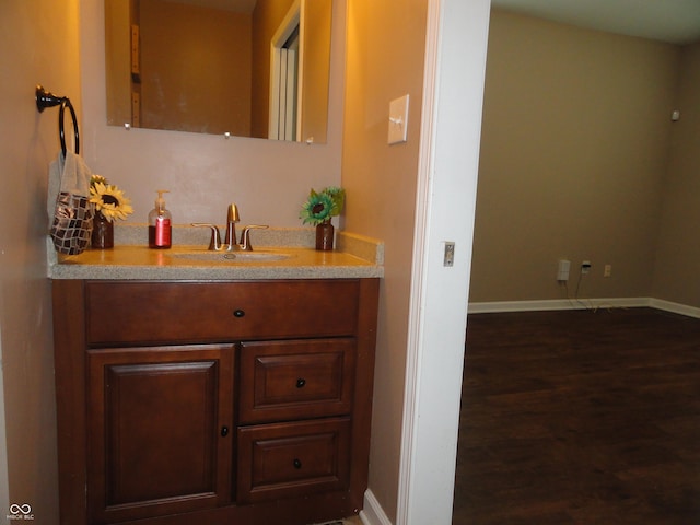 2502 N Harding St, Indianapolis, IN 46208 - bathroom with vanity and wood finished floors