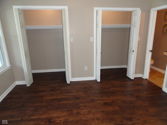 2502 N Harding St, Indianapolis, IN 46208 - unfurnished bedroom featuring dark wood-type flooring and baseboards