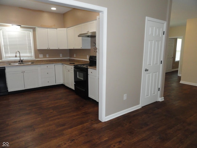 2502 N Harding St, Indianapolis, IN 46208 - kitchen with black appliances, under cabinet range hood, white cabinetry, dark wood-style floors, and recessed lighting
