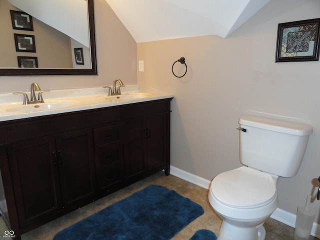 2502 N Harding St, Indianapolis, IN 46208 - bathroom with lofted ceiling and double vanity