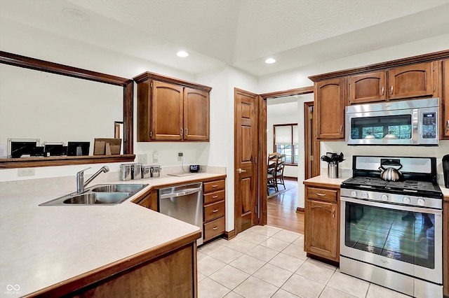 1456 Bent Tree Pl, Greenwood, IN 46143 - kitchen featuring appliances with stainless steel finishes, light tile patterned floors, light countertops, and recessed lighting